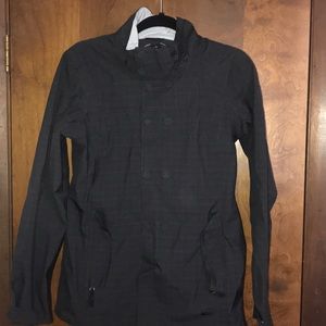 Medium gray REI zip up rain coat with pockets